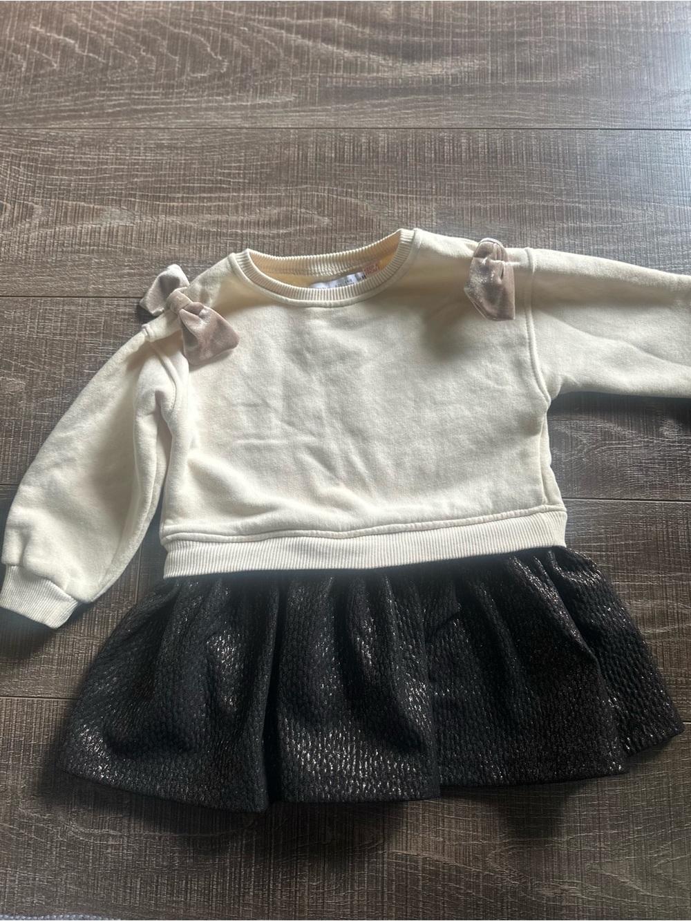 Zara cream sweater dress with black skirt and pink bows